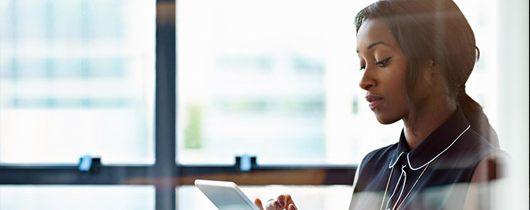 5 steps to moving your DEI strategy forward image of woman wearing glasses looking at computer screen